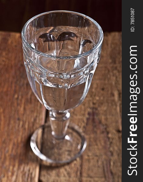 Glass with water on wooden table. Glass with water on wooden table