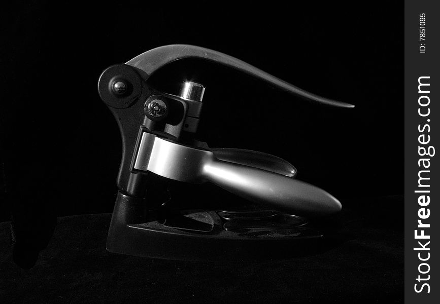 Aluminium modern corkscrew isolated on black background with soft light