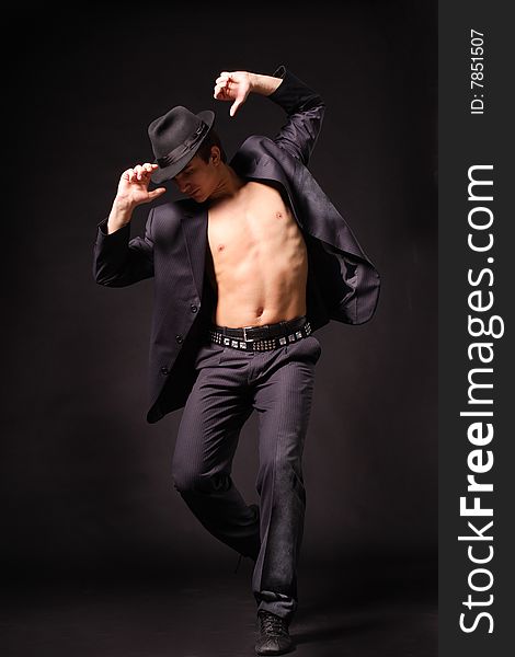 Stylish and young modern style dancer is posing