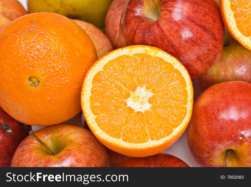 A fruit background of apples and oranges.