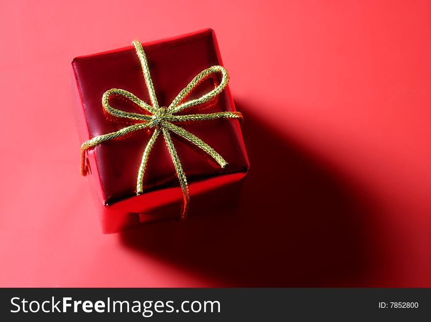 Christmas present, gift over red studio background