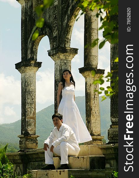 Couple in white in an old building. Couple in white in an old building