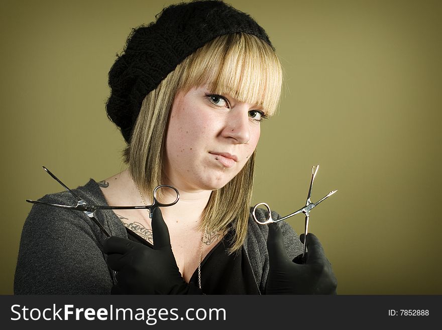Young Girl Holding Forceps In Her Hand
