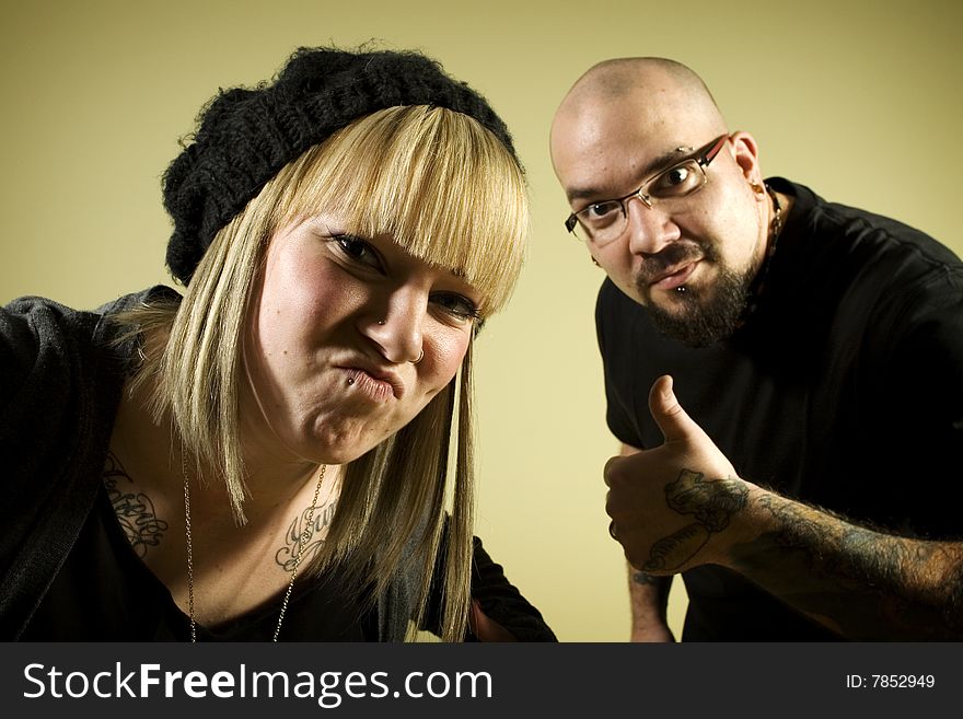 Portrait Of Two People With Tattoos