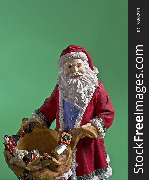 Santa Claus is coming to town stature of Santa on green background