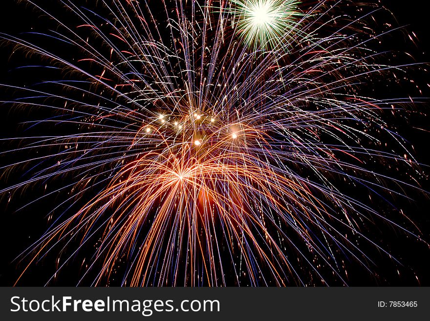 Bright colored fireworks on black background