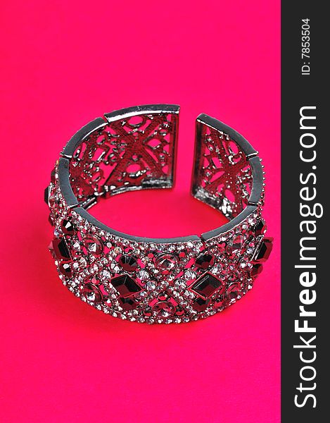 Bracelet isolated on pink background.