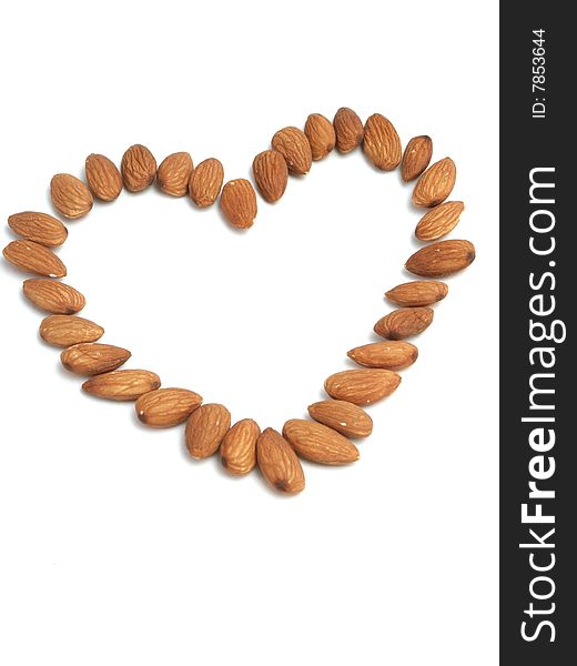 Heart Made Of Nuts Of Almonds On A White Backgroun