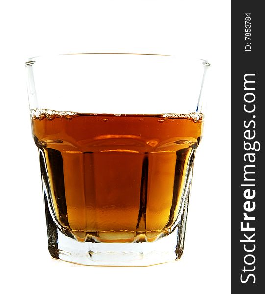 A glass cup of whiskey. A glass cup of whiskey