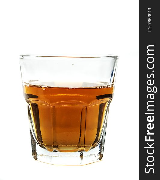 A glass cup of whiskey. A glass cup of whiskey