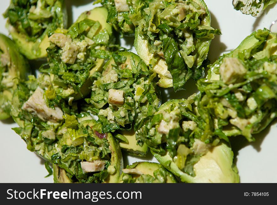 Avocado halves topped with fresh chicken salad