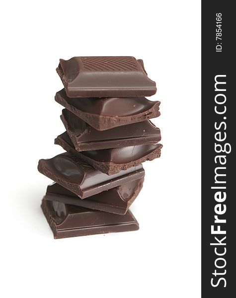 It is a lot of segments of chocolate on a white background