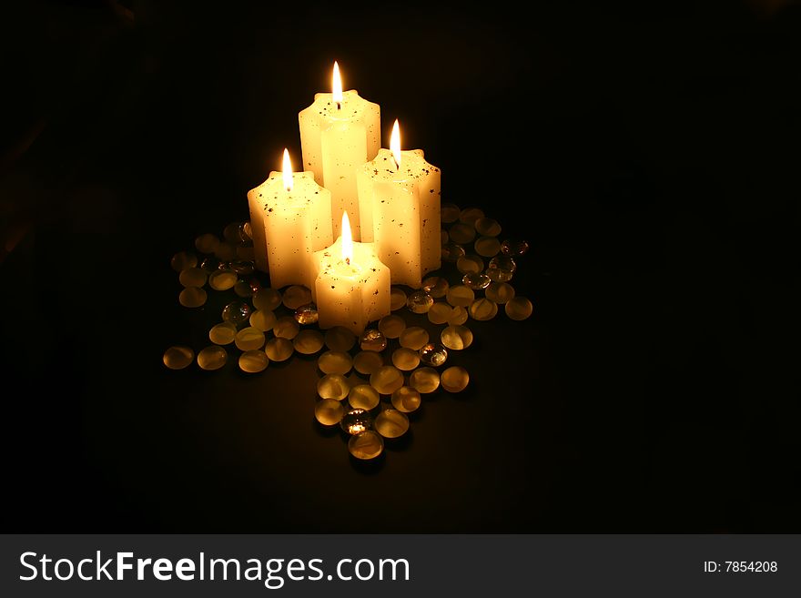 Four candle in black background with warm light. Four candle in black background with warm light