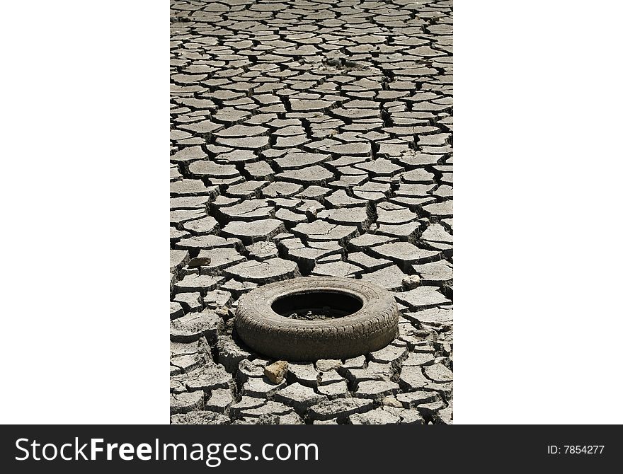 Cracked ground whit tire. Global warming concept