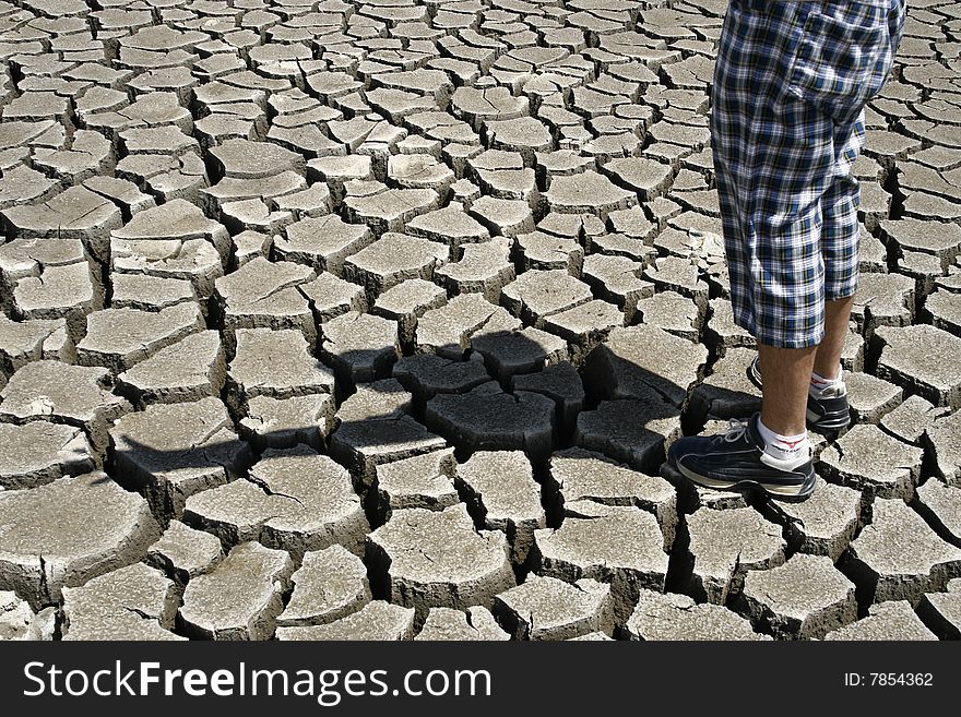Cracked ground  / Stop the environmental pollution