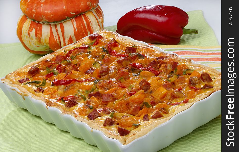 Pumpkin and pepper pie on table