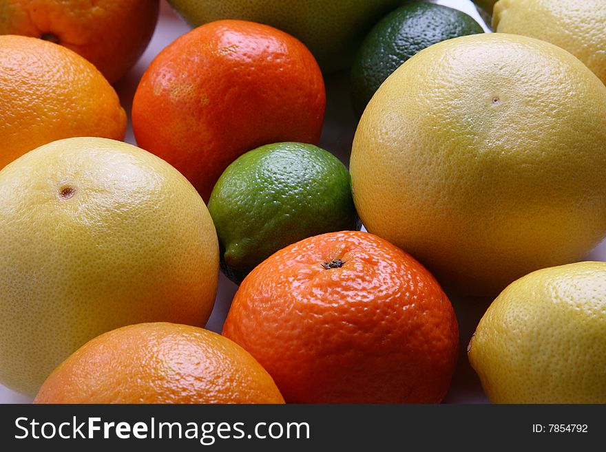 Different fresh citrus fruit on plate