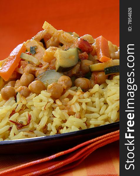 Rice with meat and vegetable sauce on plate