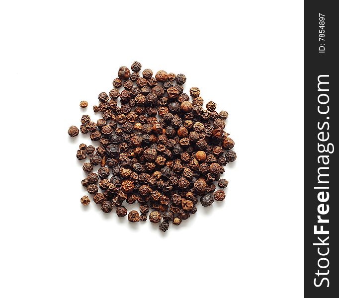 Brown pepper isolated on white
