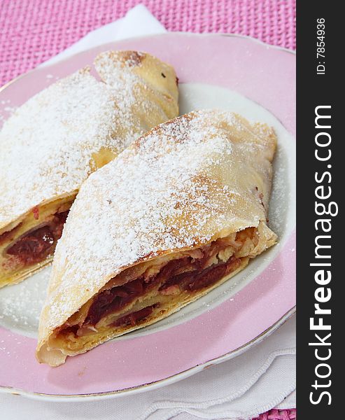 Fruit pie dessert with sugar on plate