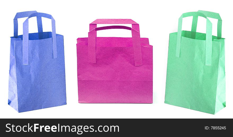 Shot of three coloured paper shopping bags on white. Shot of three coloured paper shopping bags on white