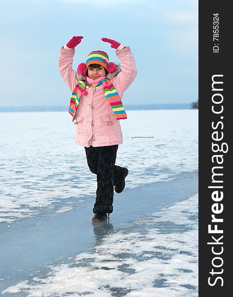Dancing child on icy river