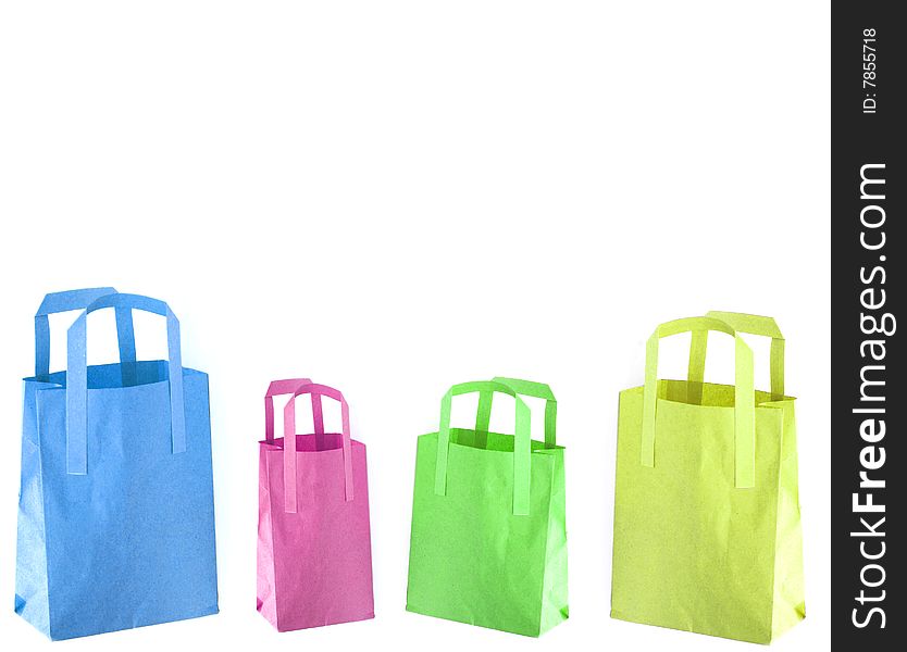 Shot of three coloured paper shopping bags on white. Shot of three coloured paper shopping bags on white