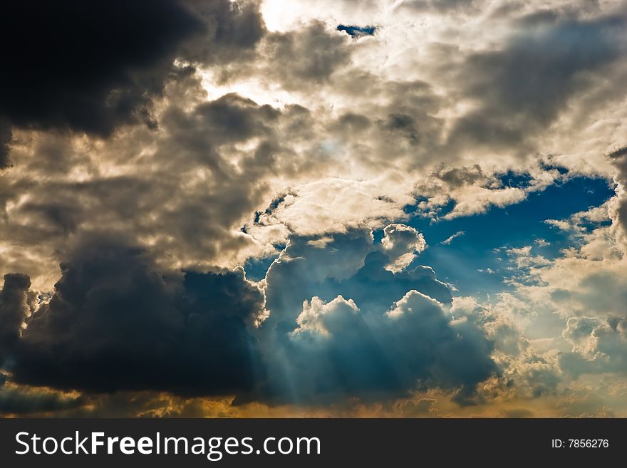 Cloudscape with sun ray shining through.