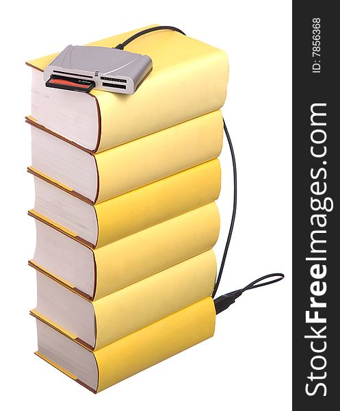 Yellow hardback books with a compact flash card reader isolated on a white background