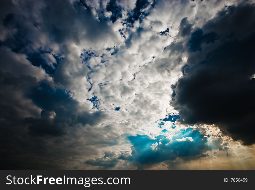 Cloudscape with sun ray shining through.