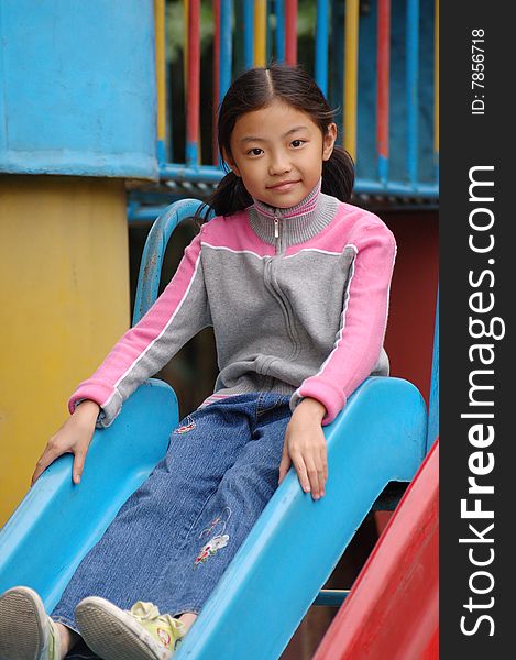 Girl  play in Amusement park