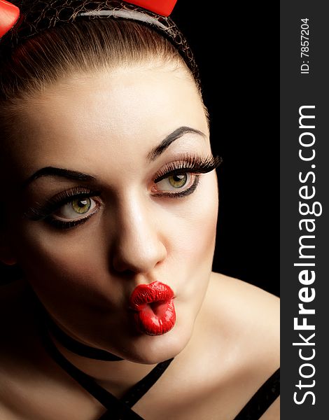 Green-eyes Girl with Red Lips over Black Background