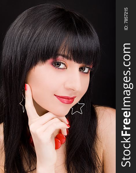 Portrait of the charming woman on black background