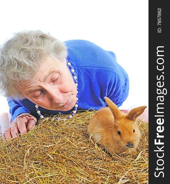Elderly woman with one small rabbit. Elderly woman with one small rabbit