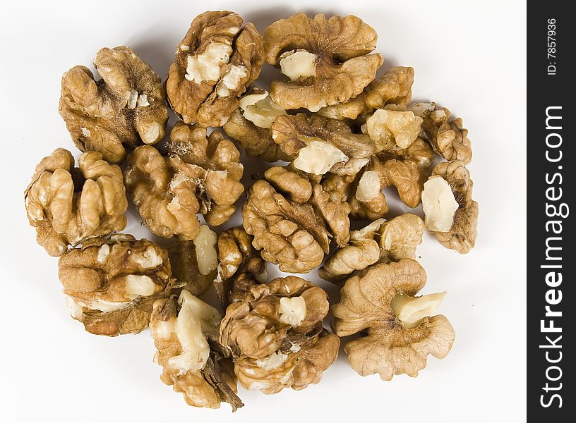 Group walnuts in brown pod without nutshell