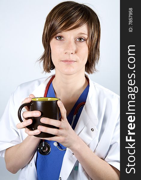 Nurse or doctor  holding a  coffee on a white blackground. Nurse or doctor  holding a  coffee on a white blackground