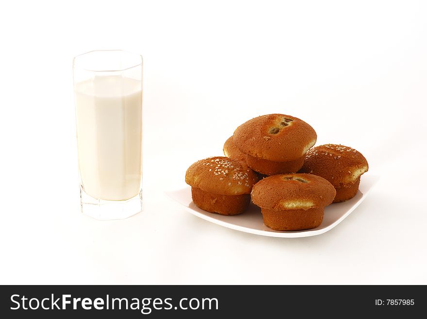 Breakfast, cake and milk with white background