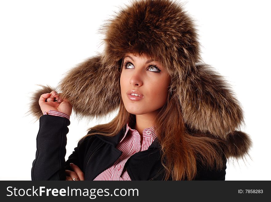 Beautiful woman in fur cap with ear flaps and bubos