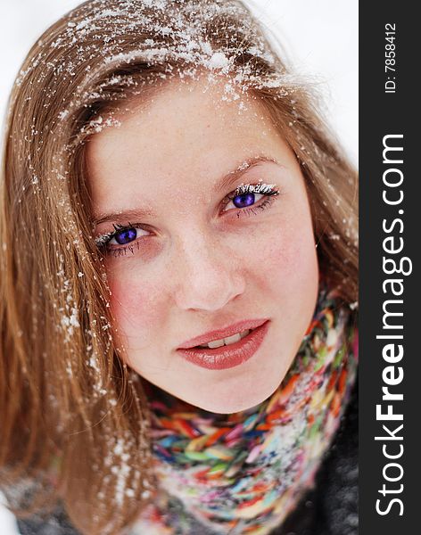 Beautiful young woman with snow on her hair. Beautiful young woman with snow on her hair