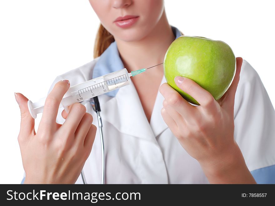 Nurse with syringe make injection in green apple. Nurse with syringe make injection in green apple