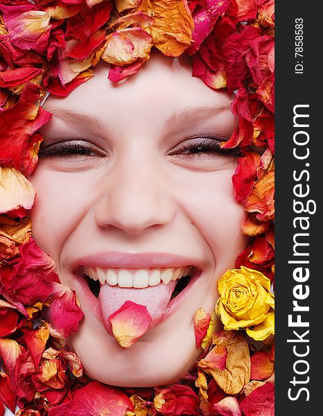 Portrait of beautiful woman with dried roses around her face. Portrait of beautiful woman with dried roses around her face