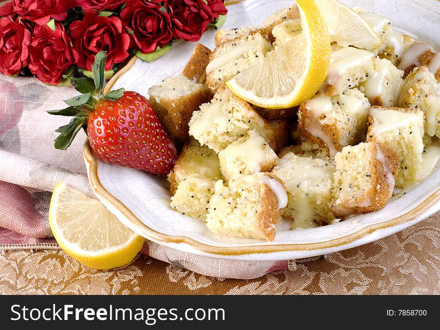 Lemon Poppy Seed Bread cut in cubes with glaze. Lemon Poppy Seed Bread cut in cubes with glaze