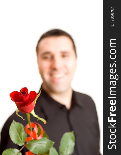 Young man giving a red rose to somebody. Young man giving a red rose to somebody