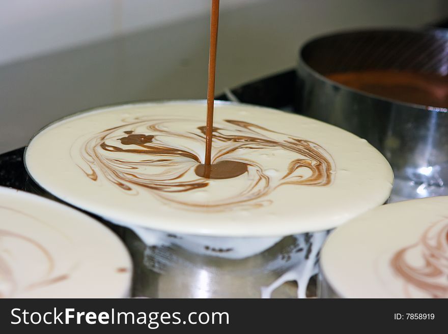 Pastry getting ready in stainless steel pans