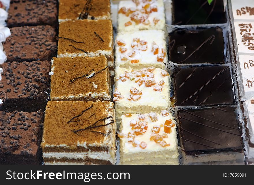 Lot of sweet cakes with chocolate topping