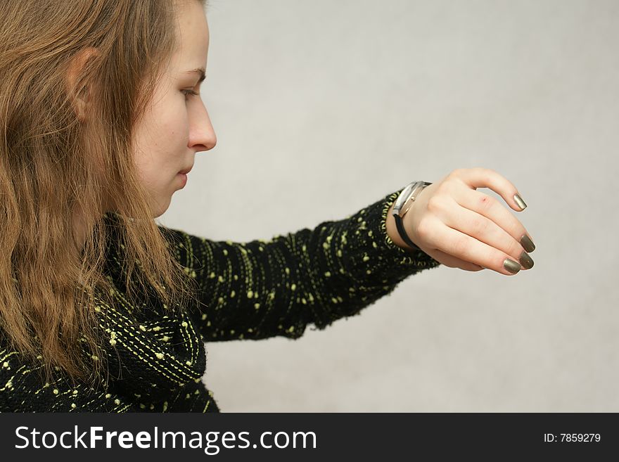 Young beautifful gril from Poland with watch in isolated photo. Home Photo Studio Sony Alpha 700. Young beautifful gril from Poland with watch in isolated photo. Home Photo Studio Sony Alpha 700