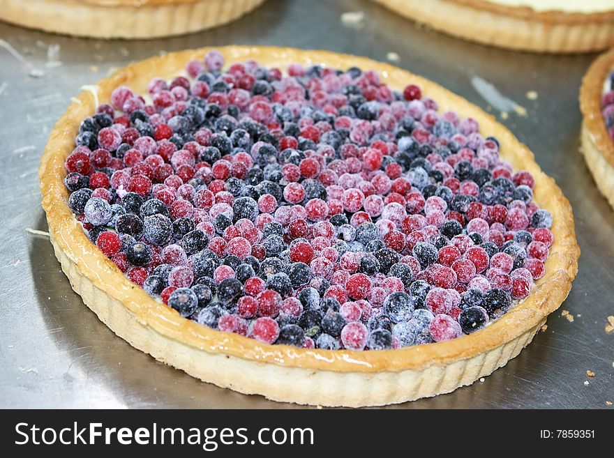 Sweet berry pie getting ready by the confectioner. Sweet berry pie getting ready by the confectioner