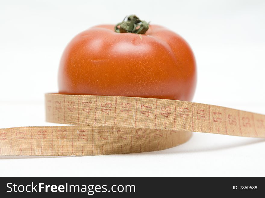 Tomato with metre on not isolated background