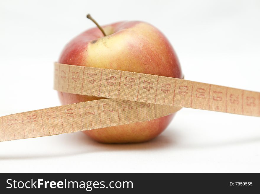 Apple with metre on not isolated background