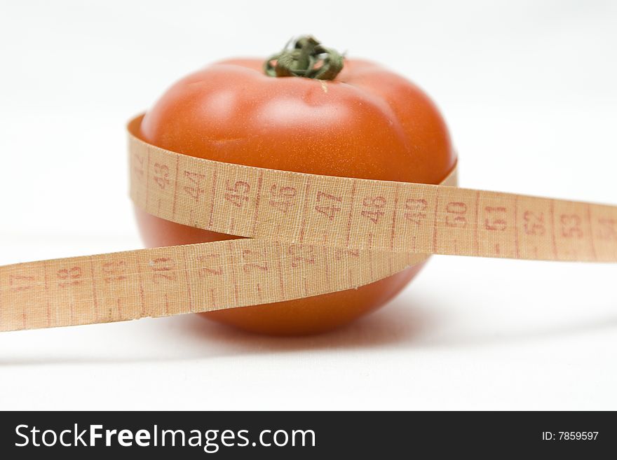 Tomato with metre on not isolated background